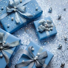 Wall Mural - Christmas gifts wrapped in blue paper with a silver silk ribbon on a white background with silver Christmas decor. New Year Christmas. Place for text. Copy space