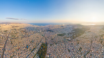 Wall Mural - Athens, Greece. Panorama of the capital of Greece during sunset. Roofs of houses. Aerial view