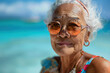 © La Neve - Elderly Woman Enjoying a Sunny Beach Day