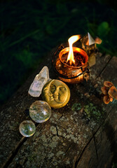 Sticker - witch cauldron, moon amulet and crystal balls in forest, abstract natural dark background. occult magic ritual, witchcraft. esoteric spiritual practice. fairytale, mystery atmosphere. top view