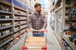 © Serhii - Portrait of happy mature man standing in hardware store
