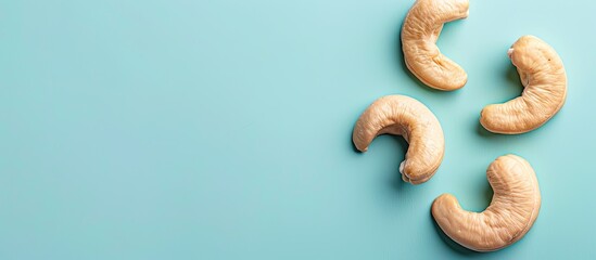 Fototapete - Tasty organic cashew nut isolated on pastel background. with copy space image. Place for adding text or design