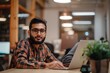 © Cloudyew - Authentic portrayal of a Muslim entrepreneur innovating in the tech industry
