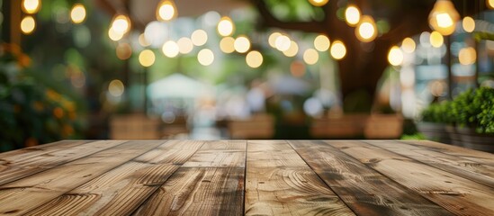 Wall Mural - Wooden empty table board in front of blurred background. Can be used for display or montage any product. Mock up for display your product. with copy space image. Place for adding text or design