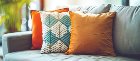 Poster - Beautiful luxury pillow on sofa decoration in living room interior - Vintage Light Filter. with copy space image. Place for adding text or design