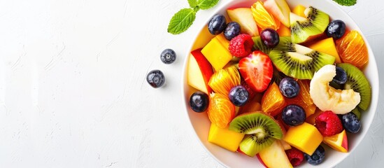 Poster - Bowl of healthy fresh mixed fruit salad isolated on white background. Copy space image. Place for adding text or design