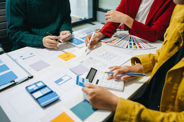 Wall Mural - ux developer and ui designer brainstorming about mobile app interface wireframe design