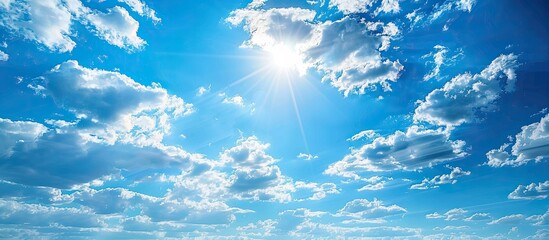 Fototapete - Beautiful blue sky with white clouds and sun. Copy space image. Place for adding text or design