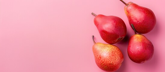 Wall Mural - Red pears pastel background  Food  Summer  Isolated. with copy space image. Place for adding text or design