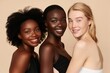 © MD Media - Three Multi Ethnic Group of Womans with diffrent types of skin and age groups together and looking on camera. Diverse ethnicity women - Caucasian, African and Asian posing and smiling.