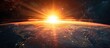 © vxnaghiyev - Dark sky background.Space sunrise, good morning world. Sunrise with rays and lens flare. with copy space image. Place for adding text or design