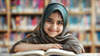 © john - Adorable smiling Pakistani Muslim girl with beautiful eyes wearing hijab, studying and doing homework on table, happy student kid reading book on blurred background of bookcase in library.