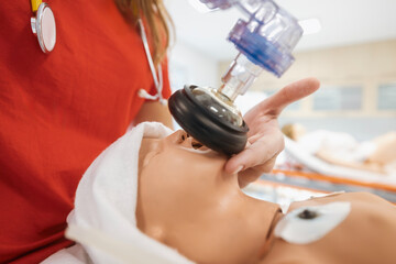 Hands of paramedic of emergency medical service during training resuscitation training on newborn dummy. .