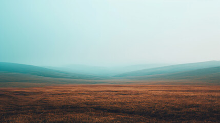 Misty Mountains Landscape with Rolling Hills and Blue Sky