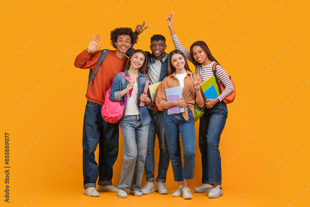 This image shows a group of diverse students smiling and posing ...