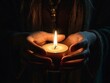© mariadelcarmen - ia generated. person with candle in hand