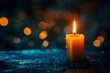 © Valentin - Close-up lit candle on table, blurry background
