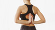 © Prostock-studio - A woman is seen practicing yoga indoors, performing the reverse prayer pose. She wears a black sports bra and dark leggings, highlighting her focus and flexibility, back view