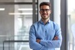 © Maxim Borbut - Standing casually in modern glass office, a businessman smiles casually at the camera - theme success, ERP, business, or boss - Stock photo