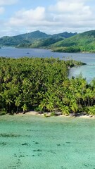 Wall Mural - Perfect tropical landscape aerial view of islands lagoon and coral vertical.