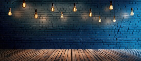 hanging electric lamps at drak blue brick wall and wood floor : interior concept. Copy space image. Place for adding text and design