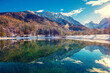 © vvvita - Mountain valley with the river in winter. The tops of the mountains are covered with snow. View of the Alps in Kranjska Gora at sunrise. Triglav national park. Slovenia, Europe