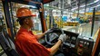 © MAGNIFIER - An employee is driving a truck to transport goods in the factory