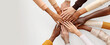 © Lahiru - A group of diverse people holding their hands together for volunteer team work. Charity or volunteer support, multi-ethnic and multicultural, charitable organization, coexistence concept.
