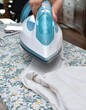 © lisica1 - young woman ironing baby clothes