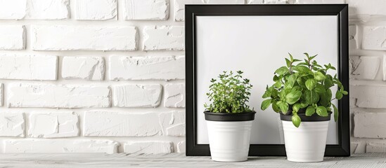 The inscription in a frame on a background of a white brick wall and two pots with herbs. with copy space image. Place for adding text or design