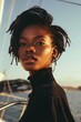 © Joyce - Fashion portrait of a female Africa-American model on yacht in sea.