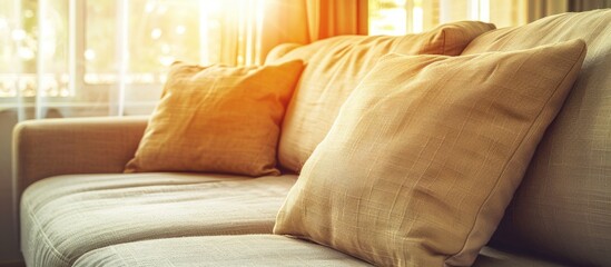 Poster - Beautiful luxury pillow on sofa decoration in living room interior - Vintage Light Filter. with copy space image. Place for adding text or design