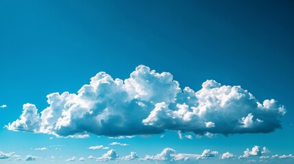 Wall Mural - A large cloud in the sky with a blue sky background