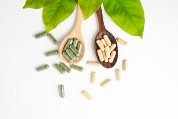 Wall Mural - Herbal capsules in wooden spoon, Natural herbs, Alternative Medicine, Herbal supplement