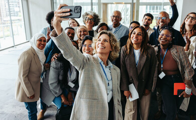 Wall Mural - diverse team taking a group selfie during seminar or workshop
