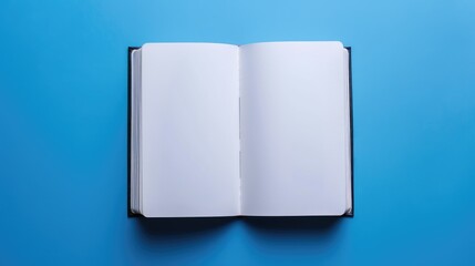 Poster - Top view of open notebook on blue background for customization Represents business office or education