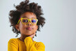 © Luluraschi - portrait of a cute nerd genius black little girl on white background