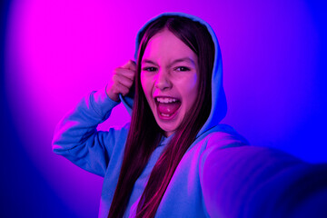 Poster - Photo of funky attractive little lady dressed hoodie recording video empty space isolated neon pink color background