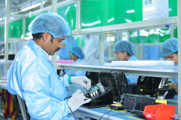 man making motherboard close up. electronic system manufacturing. computer mother board chip hardware. production process of electronic hardware. circuit board close up circuit board manufacturing