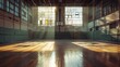© Emiliia - A view of an empty basketball court inside an industrial building. Sunlight streams through large windows, illuminating the wooden floor and casting long shadows.