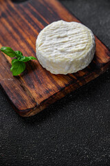 Wall Mural - soft cheese cow milk, goat or sheep cheese natural fresh appetizer meal food snack on the table copy space food background rustic top view