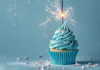 blue cupcake with sparkler on blue background