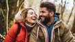 © Kowit - A man and woman are smiling at the camera in a forest