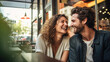 © Kowit - A man and woman are sitting at a table in a restaurant, smiling