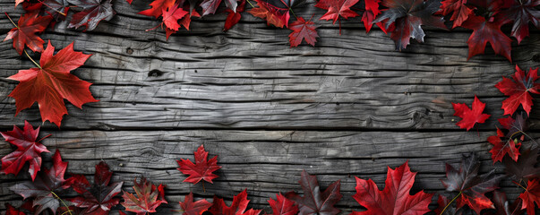 Wall Mural - Canada Day background with a rustic wooden texture and scattered maple leaves.