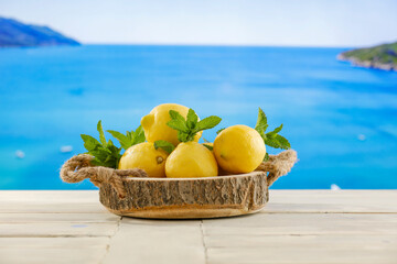 Wall Mural - Lemon fruit and mint leaves, cold fresh drinks in summer season time.