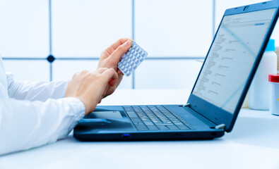 Sticker - young woman doctor examines the compatibility of a medication with other medicinal substances