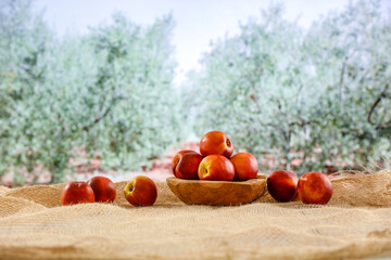 Sticker - Peach fruit on table in the park. Picnic table and healthy food.