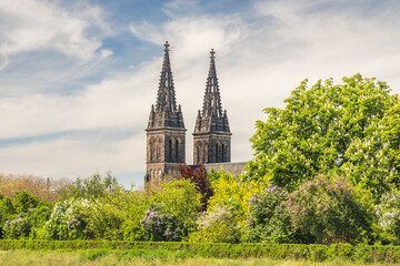 Towers of The Basilica of St. Peter and St. Paul, a neo-Gothic church in Vysehrad fortress in Prague, Czech Republic, Europe.