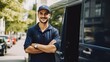 © BozStock - Delivery man standing next to his van, smiling at the camera. He is wearing a blue uniform and a cap. The van is white and has the company logo on it.
